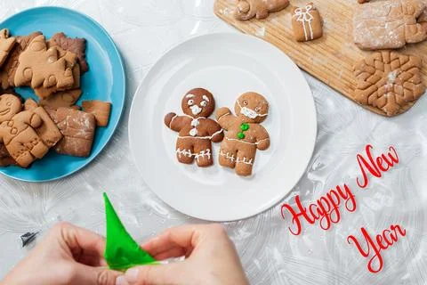 Two gingerbread men with icing in the form of a medical mask and a screamin.. Stock Photos