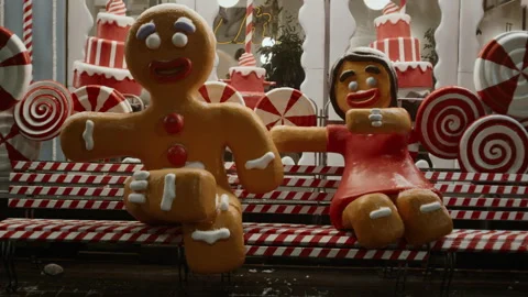Two gingerbread men sit on a bench Video stock 261405100