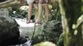 Two girl friends are laughing and talking and they are sitting on the tree HD Footage