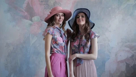 Two girl models posing in beautiful outfits Video stock 107832746