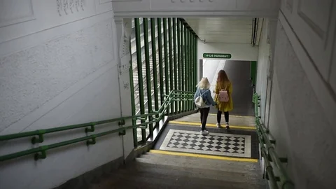Two girlfriends going down the stairs of metro station Video stock 81146798