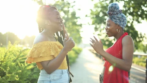 Two girlfriends having fun outdoors Stock Footage 161736847