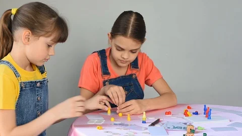 Two girlfriends at home at the weekend play board games and looked at the frame Stock Footage 129269380