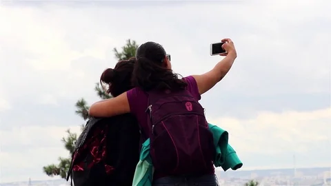 Two girlfriends taking selfies Stock Footage 78500323