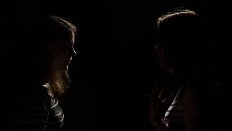 Two girls angry with each other. Anger, quarrel, violence. Unhappy mother and Stock Footage