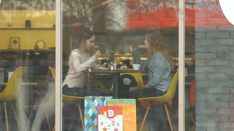 Two girls in a cafe. Stock Footage 84835314