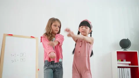 Two girls dancing in the classroom Video stock 188811230