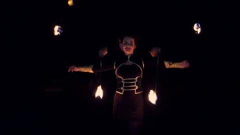 Two girls dancing with fire. Fire show amazing at night. Dances with fire in the Stock Footage