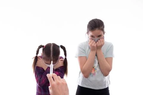 Two girls do not want to be given an injection Stock Photos