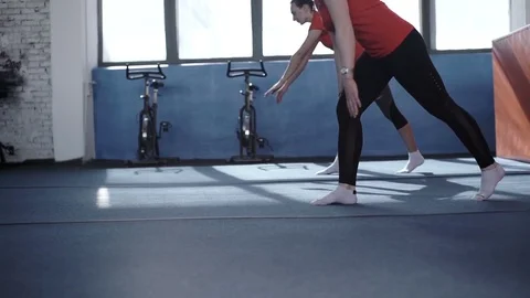 Two girls doing synchronized exercise Stock Footage 75099879