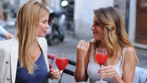 Two girls drinking aperitif in rome Stock Footage 86735832