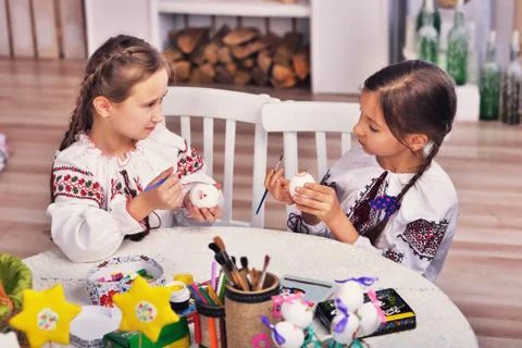 Two girls with easter eggs Stock Photos