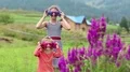 Two girls in glasses in shape of stars looks at the camera and makes grimaces HD Footage