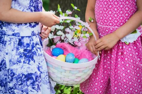 Two Girls Hands Holding an Easter Basket - Close Up Stock Photos