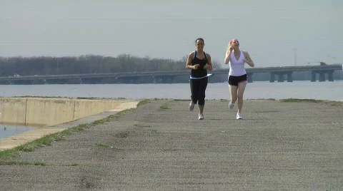 Two girls jogging3 Stock Footage