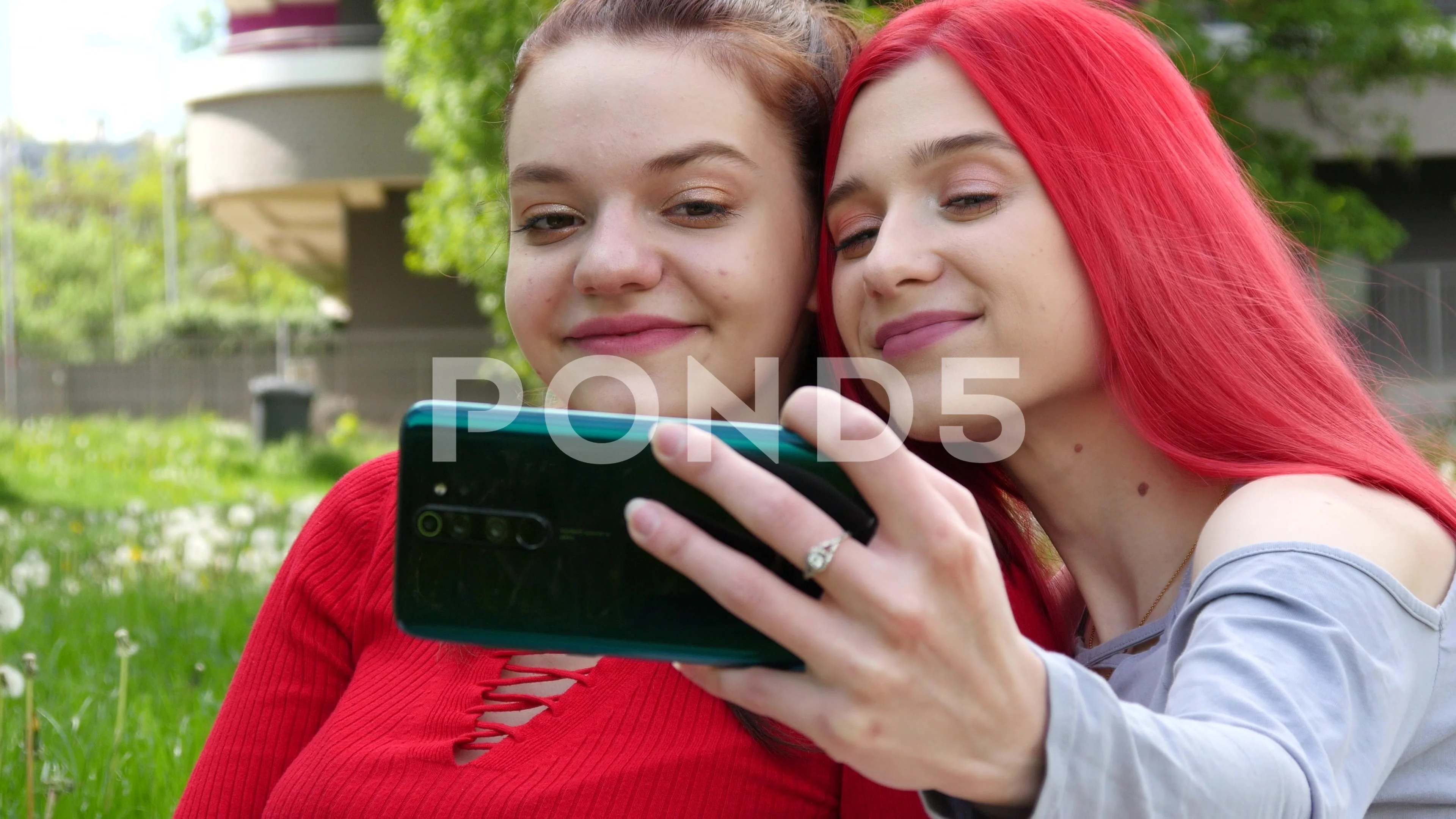 two women kissing selfies