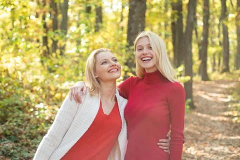 Two girls outdoors enjoying nature. Autumn female models, fashion portrait women Stock Photos