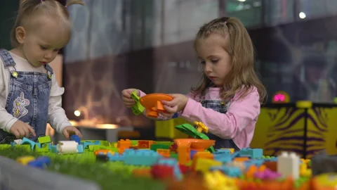 Two girls play constructor on the playground. Stock Footage 150339202