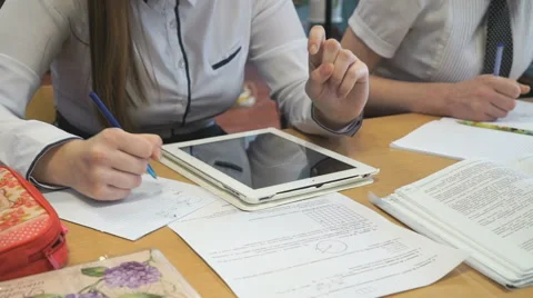 Two girls play in game using a electronic tablet Stock Footage 61771710