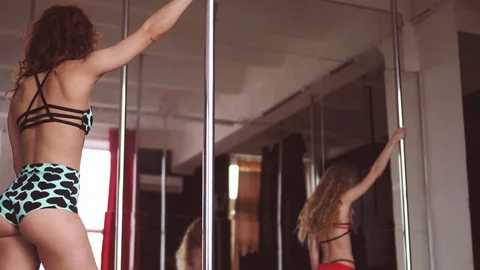 Two girls pole dance training Stock Footage 91178664