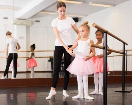 Two girls practicing choreographic elements Stock Photos