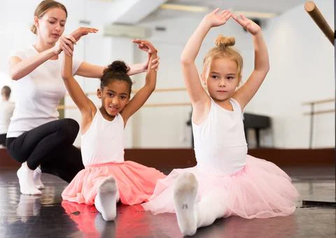 Two girls practicing choreographic elements Stock Photos