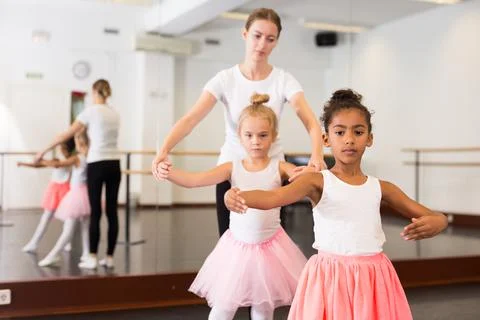 Two girls practicing choreographic elements Stock Photos
