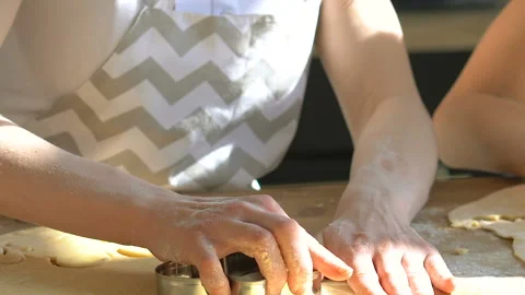 Two girls preparing daugh and cookies. Stock Footage 106024563