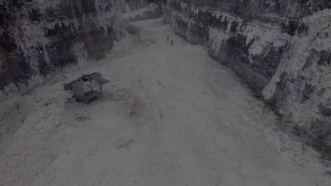 Two girls running between limestone cliffs aerial view Stock-Footage 75647519