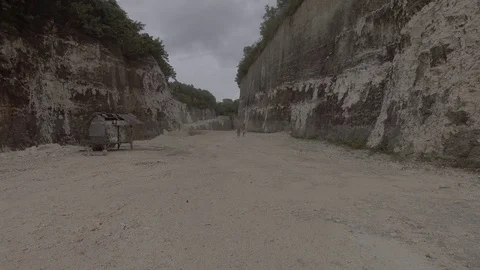 Two girls running between limestone cliffs Stock Footage 75648462