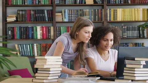 Two girls study by book laptop Video stock 89648675