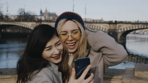 Two girls taking selfie on background of Europeann city. Friendship, lgbt Stock Footage 123797696