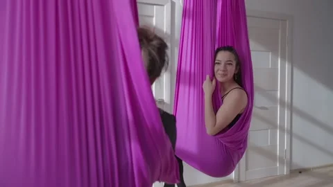 Two girls talk in hammocks - medium shot Stock Footage 222325153