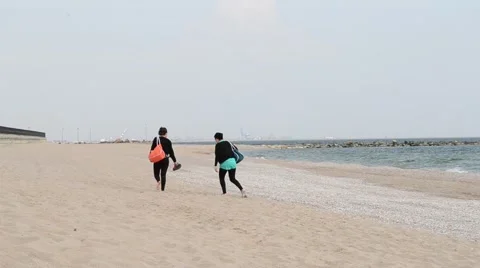 Two Girls Walking on Beach Stock Footage 46128522