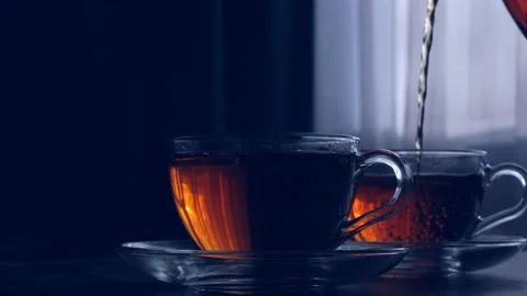 Two glass cups with black tea on the table Stock Footage 169088226
