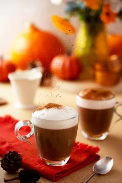 Two glass cups of pumpkin autumn latte warm drink with whipped cream, autumn  Stock-Fotos
