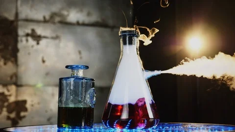 Two glass flasks on the table with illumination Stock Footage 87553475