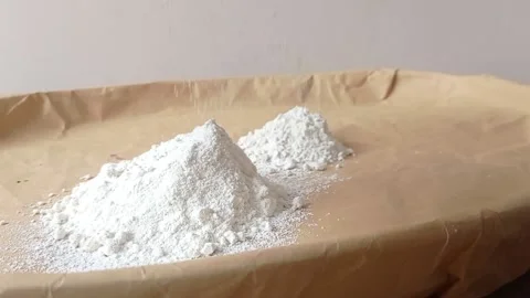 Two glass of flour on a big brown plate Stock Footage 146249082