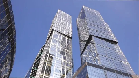 Two glass skyscrapers on the background of a cloudless sky 스톡 동영상 69170818