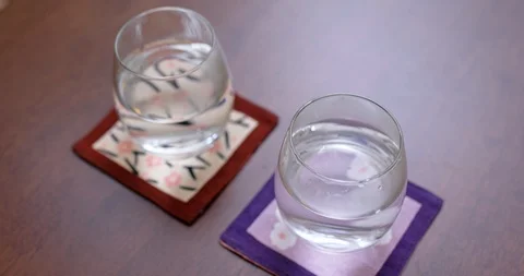 Two glass of water shake under Earthquake Stock Footage 119610051