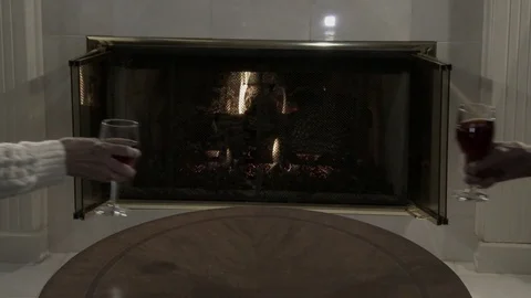 Two glass of wine on table as hands pick them up for a drink, 4K. Stock Footage 84791422