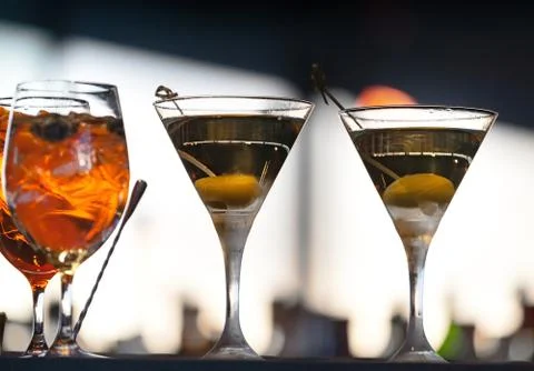 Two glasses of alcoholic drinks with olive Stock Photos