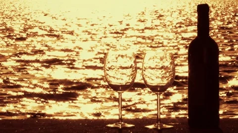 Two Glasses and Wine Bottle at Seaside Stock Footage 51629624