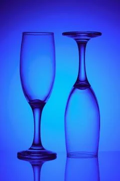 Two glasses in blue light Stock Photos