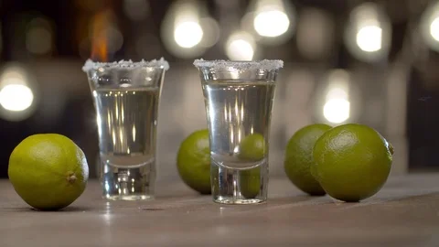 Two glasses with burning tequila Stock Footage 125390100