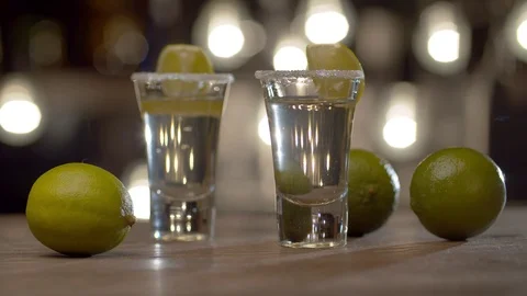 Two glasses with burning tequila Stock Footage 125390712