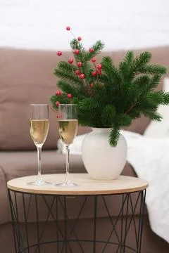 Two glasses of Champagne on caffee table in living room. Christmas home interior Stock Photos