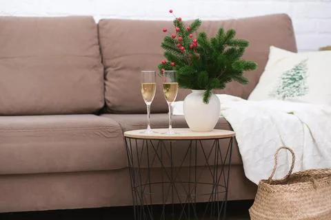Two glasses of Champagne on caffee table in living room. Christmas home interior Stock Photos