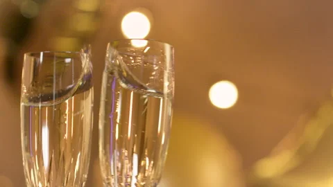 Two glasses of champagne clink Stock Footage 135243833