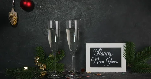 Two glasses of champagne  on dark background Stock Footage 208073619